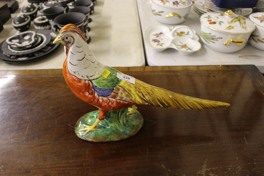 A pottery pheasant ornament