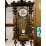 A Vienna walnut cased two hole wall clock