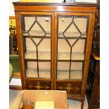 An Edwardian mahogany and inlaid display cabinet