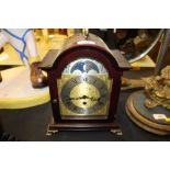 A reproduction mahogany cased bracket clock