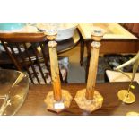 A pair of Arts & Crafts painted wooden candlestick