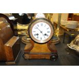 A walnut cased two hole balloon mantel clock