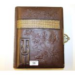 A Victorian leather bound photo album lacking cont