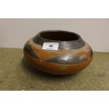 A vintage Native American earthen ware bowl with g