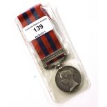 A military medal with attached clasp 'Burma 1887 -