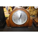 An Enfield oak cased three hole mantel clock