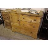 A stripped pine side cupboard fitted three drawers