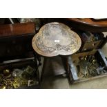 An oak clover leaf topped occasional table raised