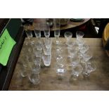 A quantity of various drinking glasses