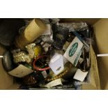 A box of various costume jewellery, pens, a table