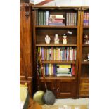 A Dutch style oak bookcase, raised on cupboard bas