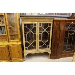 A mahogany and astragal glazed cabinet on stand