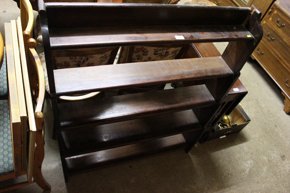 A stained pine open bookcase