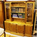 A Ducal pine and glazed dresser raised on cupboar