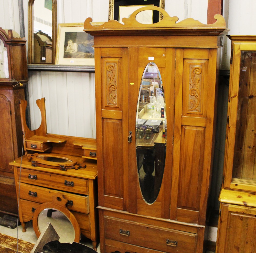 A late Victorian satinwood single door wardrobe; a