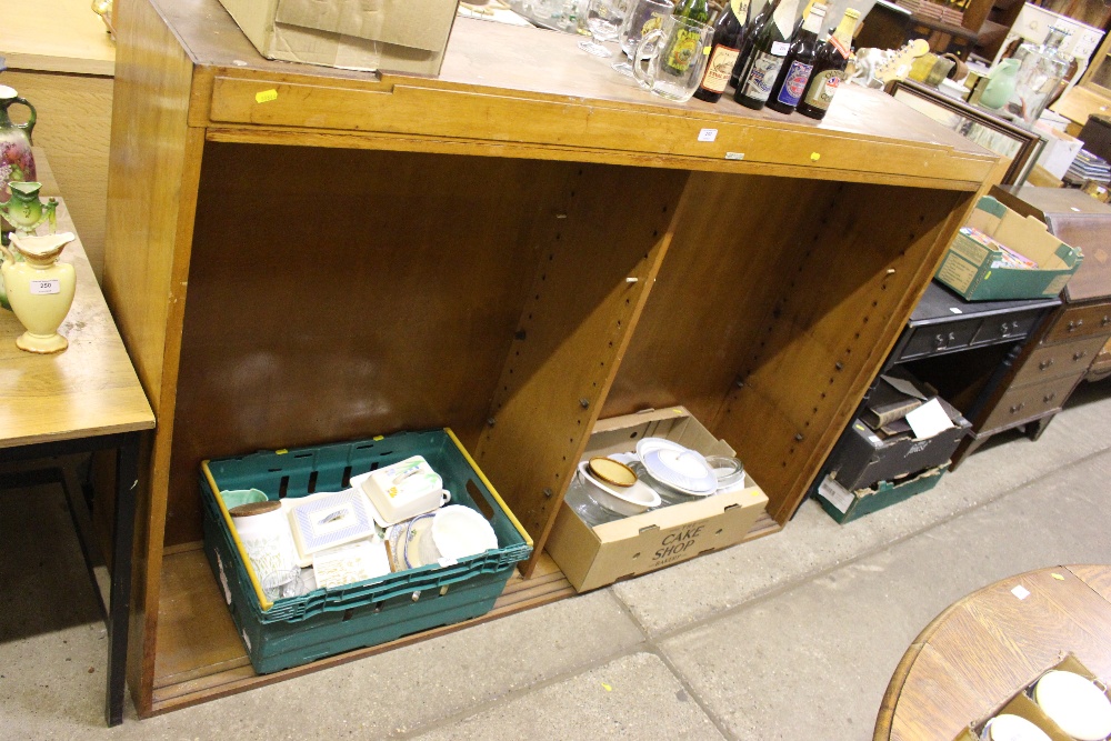 An Art Deco golden oak bookcase top