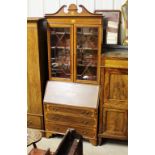 An Edwardian mahogany and inlaid bureau bookcase f