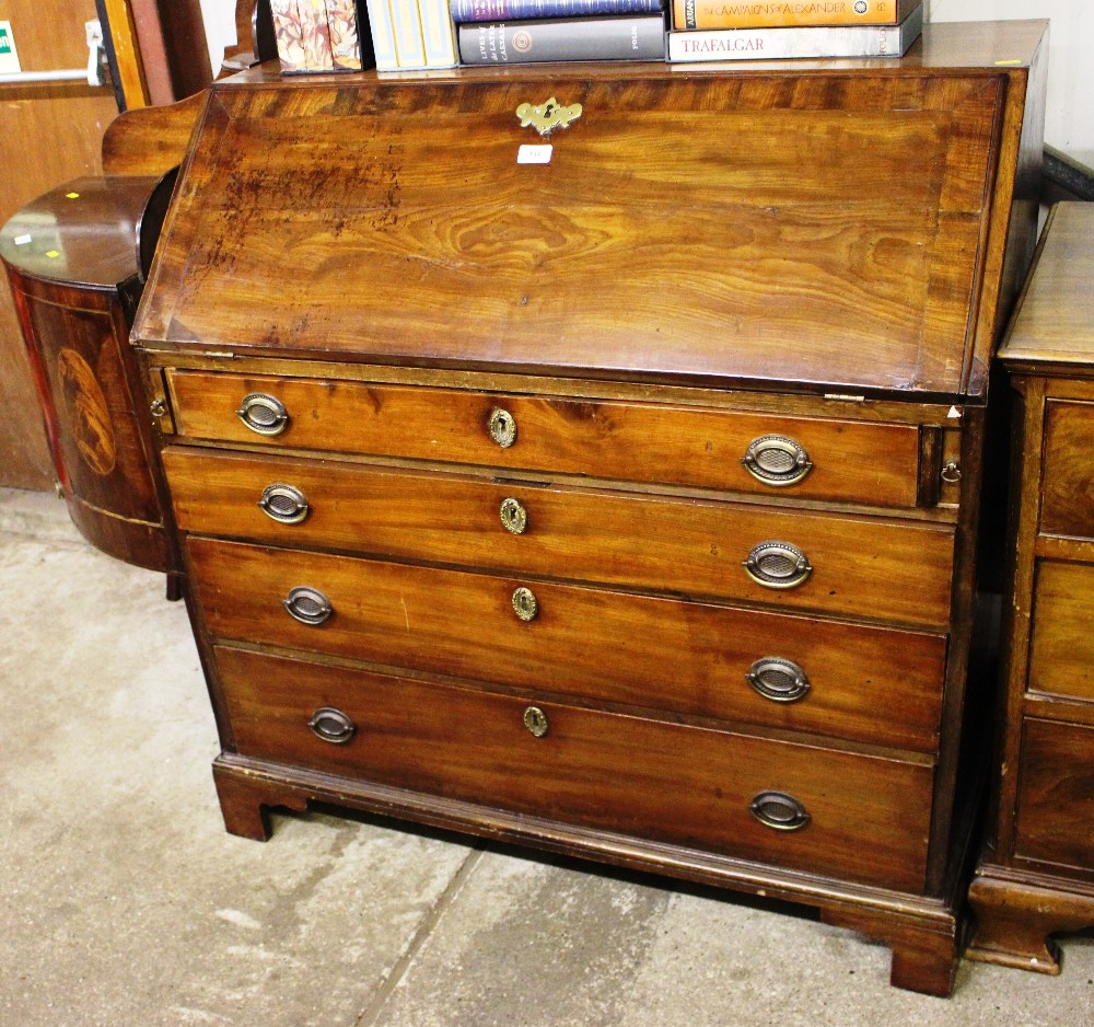 A George III mahogany bureau fitted four long draw