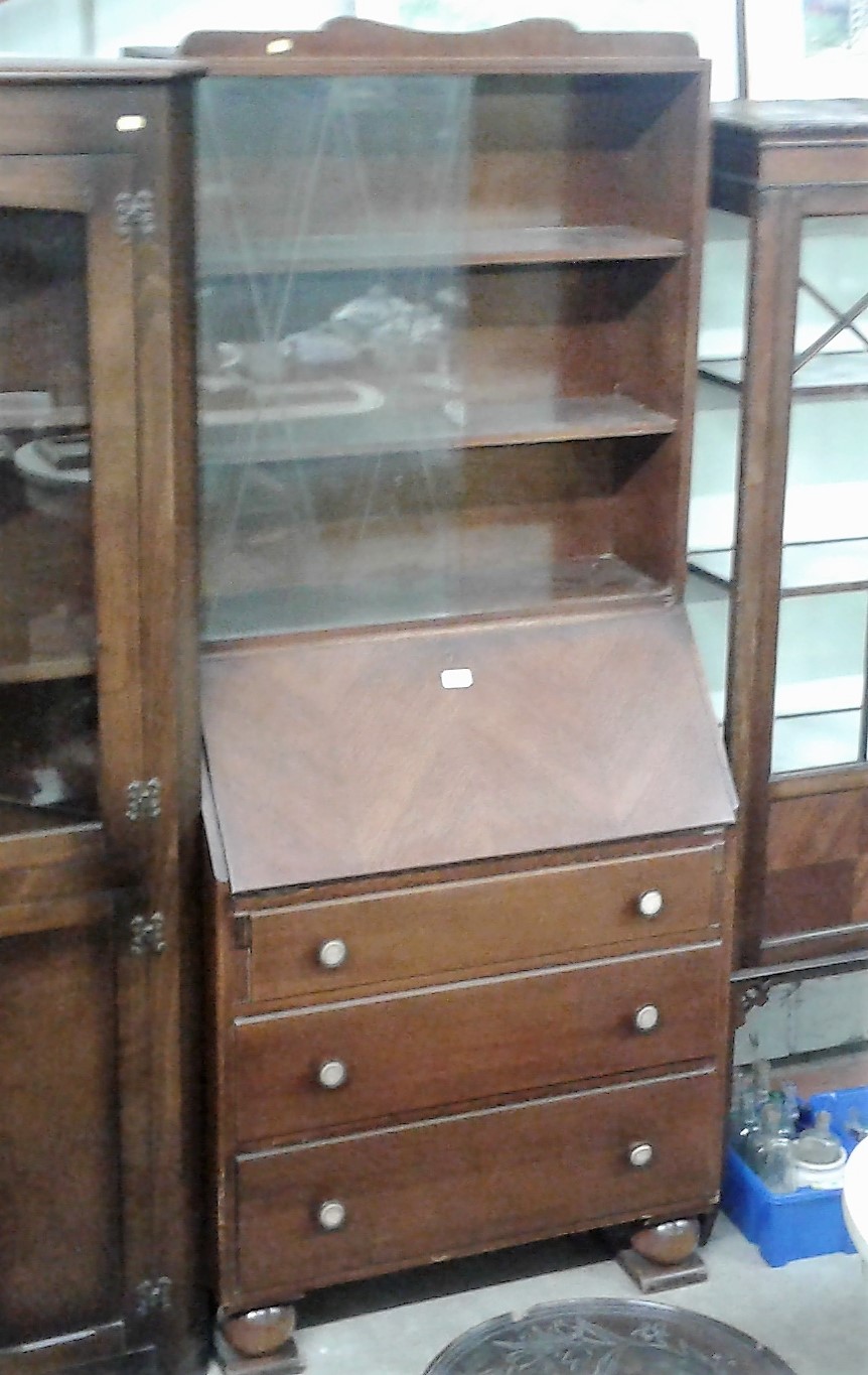 An oak veneered bureau bookcase