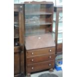 An oak veneered bureau bookcase