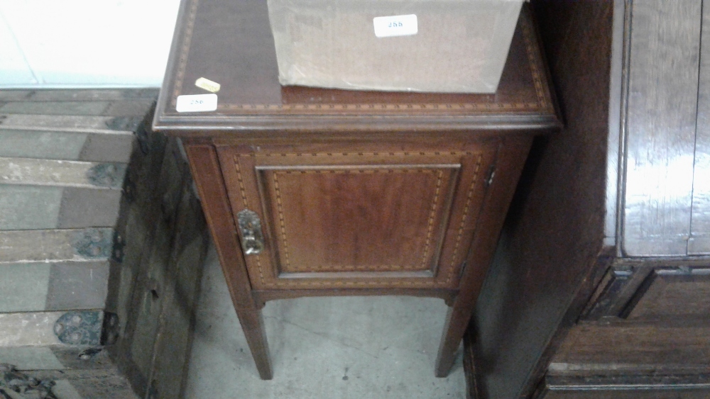 An Edwardian mahogany and inlaid pot cupboard