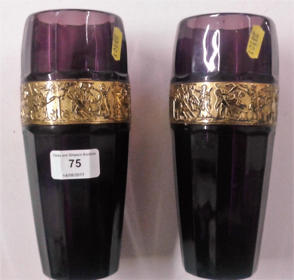 A pair of amethyst glass vases with gilt metal ban