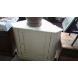 A painted pine corner cupboard