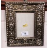 A brass embossed photo frame