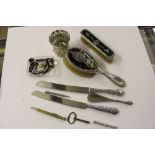 A box of mixed silver items to include dressing ta