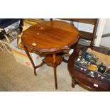 An Edwardian shaped top window table