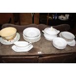 A quantity of white and gilt decorated dinnerware;