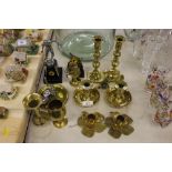 A quantity of brass candlesticks, chamber stick, t