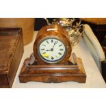 A Victorian walnut single hole mantel clock