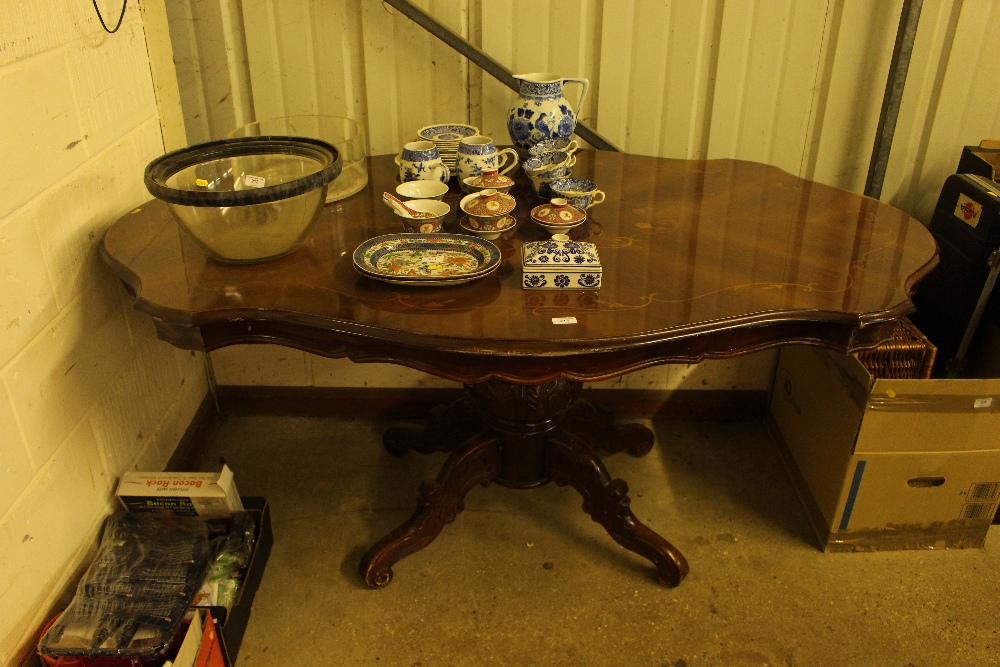 An Italian style inlaid dining table