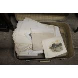 A suitcase of unframed prints