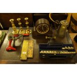 Two cribbage boards; a silver plated coffee pot; an oak mantel clock; three brass candlesticks etc.