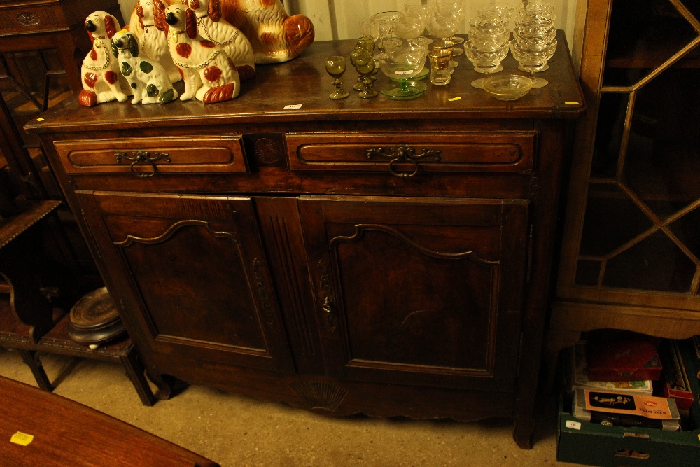 A 19th Century French fruit wood buffet fitted two