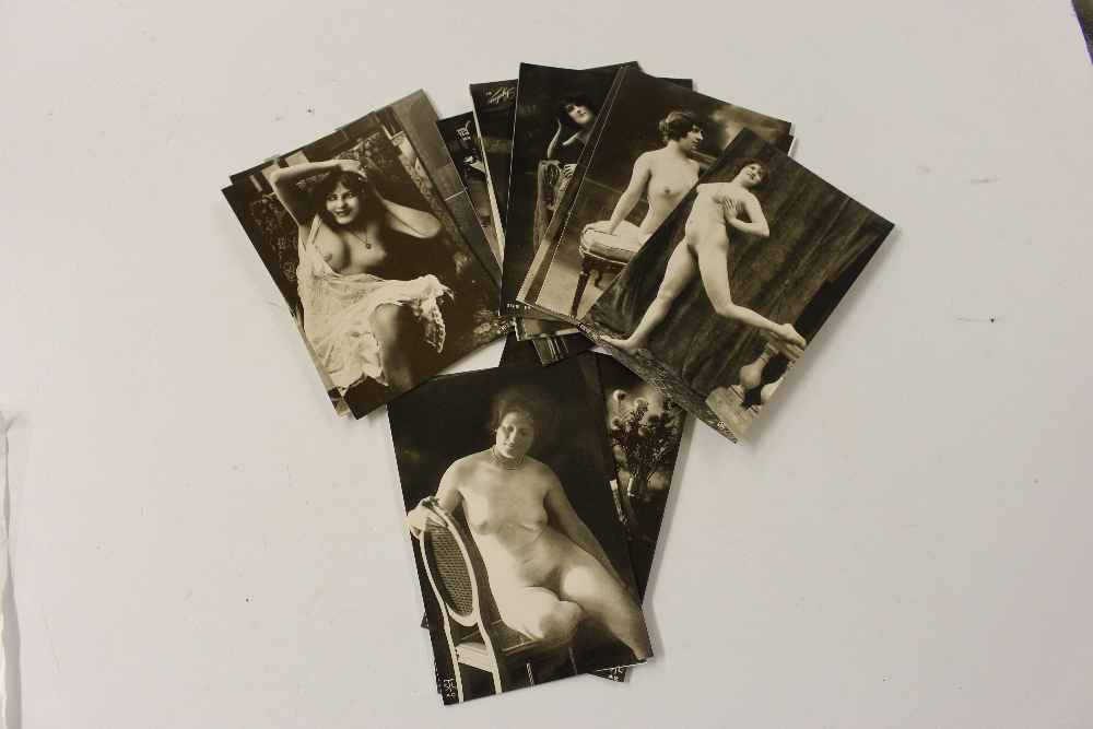 A packet of postcards depicting nude females