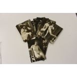 A packet of postcards depicting nude females