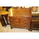 An 18th Century oak bureau fitted two short over t