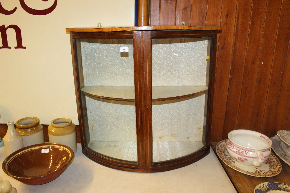 An Edwardian mahogany and inlaid bow front wall ca