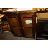 A 1920's oak and glazed cabinet with info