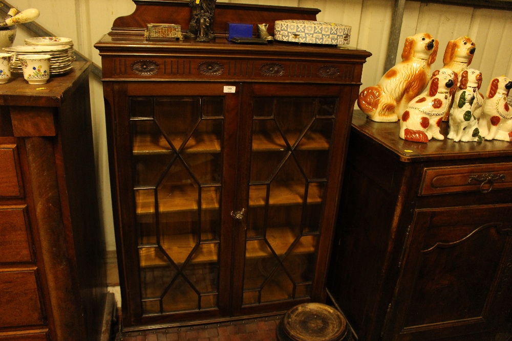 An Edwardian mahogany and bevelled glass display c