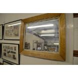 A birds eye maple framed wall mirror