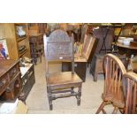 An 18th Century and later carved oak hall chair A