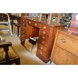 A Victorian mahogany writing desk fitted thirteen