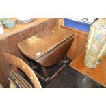 A small oak drop leaf coffee table; a black ash ef