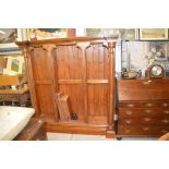 A heavy pitch pine open fronted bookcase