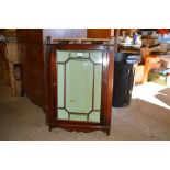 A reproduction mahogany and glazed corner cabinet