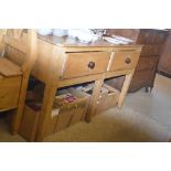 A stripped pine dresser base fitted two drawers